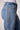 Close-up of the Blue Revival Beau button down jeans in Ora showing the gold button detailing along the side.