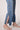 Close-up of the Blue Revival Beau jeans in Ora showing the raw hem and straight-leg ankle length.