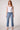 Woman wearing the Blue Revival Beau button down jeans in Ora with a mid-rise straight-leg fit.
