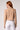 Blue Revival Chloe cropped hooded blazer in camel without removable white hoodie insert, back view.