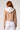 Blue Revival Chloe cropped hooded blazer in camel with removable white hoodie insert, back view.