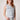 Blue Revival cropped denim vest in ultra light with silver hardware buttons and front pockets.