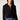 Blue Revival Fireside cropped blazer in black with removable puffer hoodie insert, featuring a double-breasted front and flap pockets.