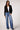 Blue Revival Fireside cropped black blazer without the removable puffer hoodie insert, featuring a double-breasted front and classic flap pockets.