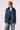 Blue Revival Gracie trench coat with removable black hoodie insert in medium stone, featuring a double-breasted silhouette and tie belt.