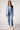 Woman wearing the Blue Revival Helen blazer in heather blue with removable denim insert and a fitted silhouette.