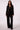Woman wearing the Blue Revival Helen double breasted blazer in black with removable hoodie insert.