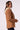 Blue Revival Helen double breasted blazer in toffee, side view showing the fitted silhouette and cream hoodie insert.