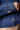 Blue Revival Lana cropped denim trench in Lisbon, close-up showing the belted cuff and decorative button detail.