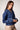 Blue Revival Lana cropped denim trench in Lisbon, featuring a double-breasted front, decorative buttons and belted cuffs.