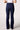 Blue Revival Maya mid-rise recycled bootcut jeans in Amsterdam dark wash, back view showing the back pockets and bootcut leg.