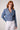 Blue Revival Olivia cropped recycled denim blazer in medium wash, featuring a double-breasted button closure, silver hardware and front pockets.