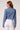 Blue Revival Olivia cropped recycled denim blazer in medium wash, back view showing the fitted cropped silhouette and denim construction.