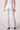 Blue Revival Palazzo pants in white, back view showing the wide-leg silhouette and clean tailored finish.