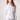Blue Revival Piper peplum jacket in white with sculpted waist-cinching fit and silver buttons.