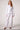 Blue Revival Piper peplum jacket in white styled with the Palazzo Pant in white for a polished coordinated look.