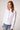 Blue Revival Piper peplum jacket in white with sculpted waist-cinching fit and silver buttons.