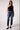 Woman wearing Blue Revival Quinn mid-rise straight ankle jeans in Marrakesh with a classic 5-pocket design.