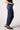 Blue Revival Quinn mid-rise straight ankle jeans in Marrakesh, side view showing the straight-leg silhouette and ankle-length fit.
