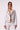 Blue Revival Sadie denim jacket in white with tan faux suede detailing and brown button closures.