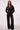 Blue Revival Charli cropped trench coat in black with double-breasted decorative buttons and a cinched tie waist.