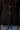 Blue Revival Toasty black blazer showing front flap pockets and silver zipper detail.