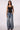 Woman wearing Blue Revival Waverly mid-rise wide leg jeans in Dallas wash with a relaxed silhouette and classic 5-pocket design.
