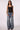 Woman wearing Blue Revival Waverly mid-rise wide leg jeans in Dallas wash, styled for an effortless everyday look.